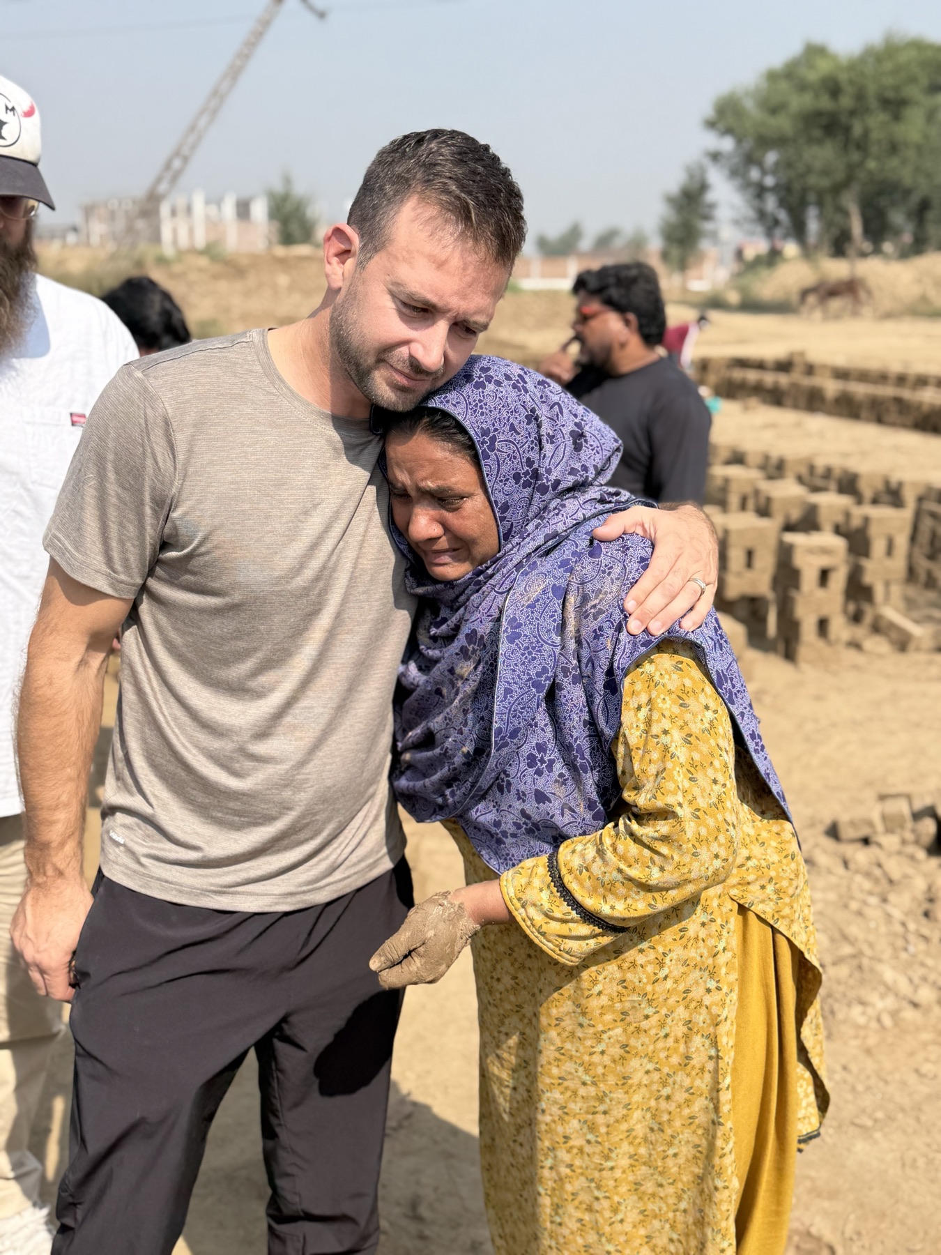 A newly freed woman embraces an Exodus51 team member at a brick kiln